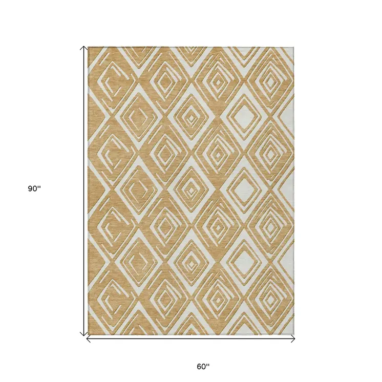 5' X 8' Gold And Ivory Geometric Washable Indoor Outdoor Area Rug