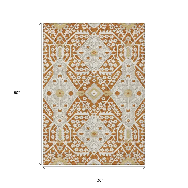3' X 5' Orange Beige And Gold Floral Washable Indoor Outdoor Area Rug