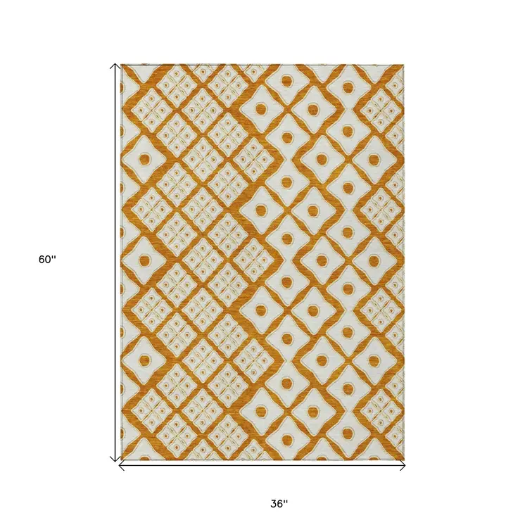 3' X 5' Orange And Ivory Geometric Washable Indoor Outdoor Area Rug