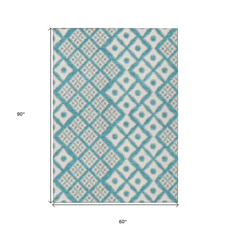 5' X 8' Teal Blue And Ivory Geometric Washable Indoor Outdoor Area Rug