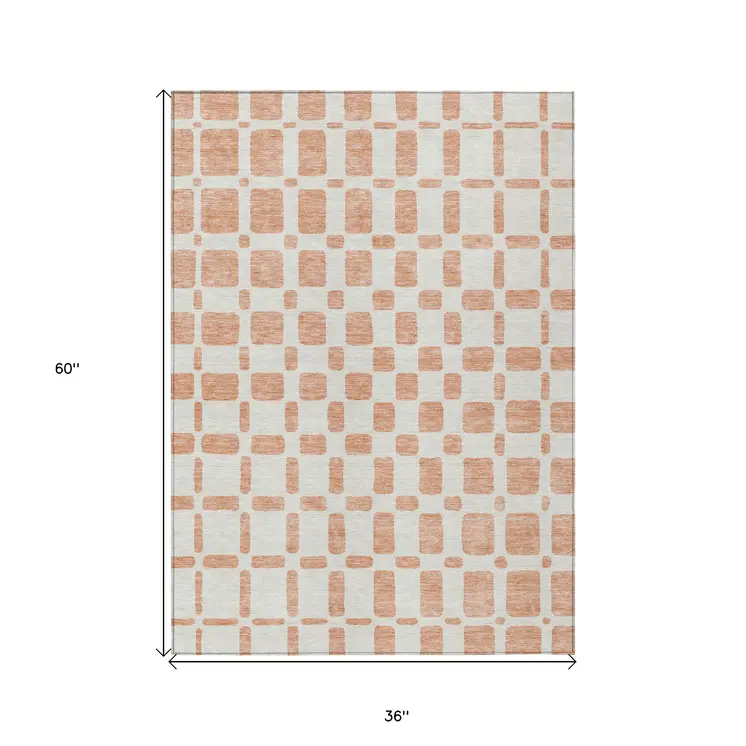 3' X 5' Peach And Beige Geometric Washable Indoor Outdoor Area Rug
