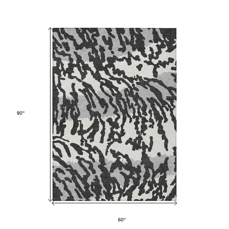 5' X 8' Black Gray And Ivory Animal Print Washable Indoor Outdoor Area Rug