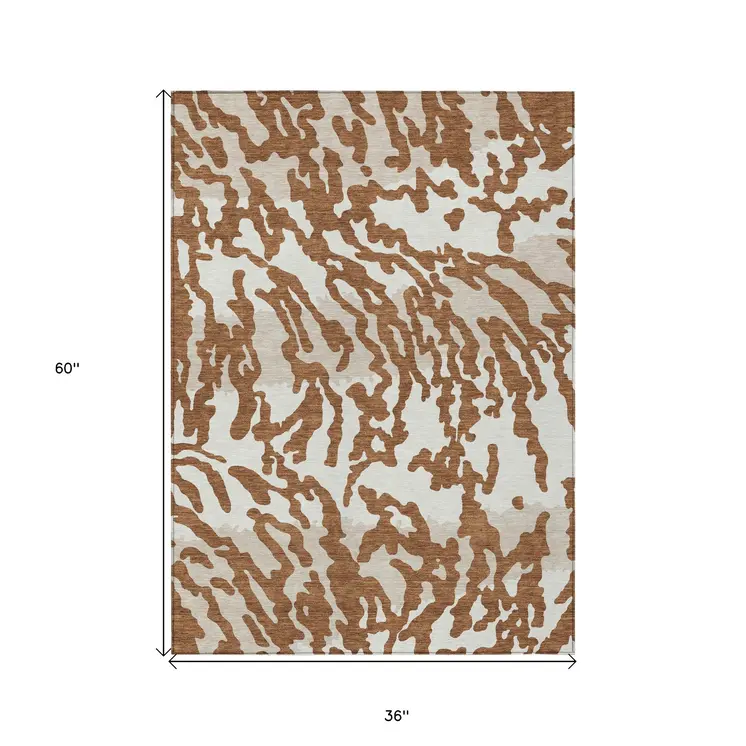 3' X 5' Brown Beige And Ivory Animal Print Washable Indoor Outdoor Area Rug