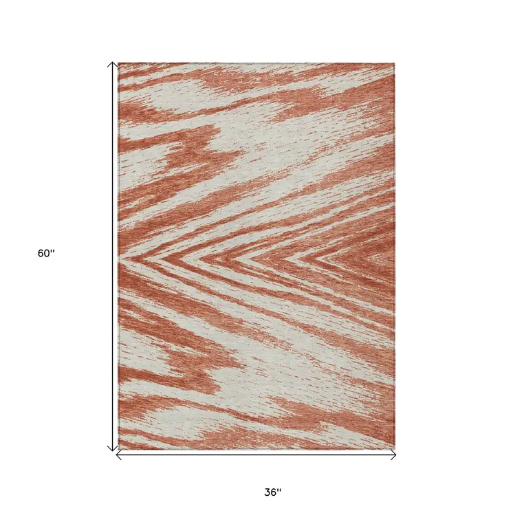 3' X 5' Salmon And Ivory Abstract Washable Indoor Outdoor Area Rug