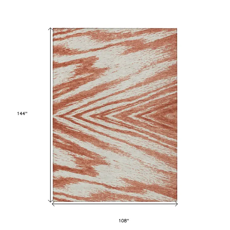 9' X 12' Salmon And Ivory Abstract Washable Indoor Outdoor Area Rug