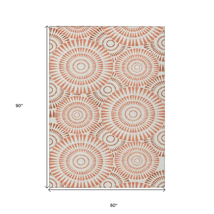 5' X 8' Coral And Ivory Geometric Washable Indoor Outdoor Area Rug