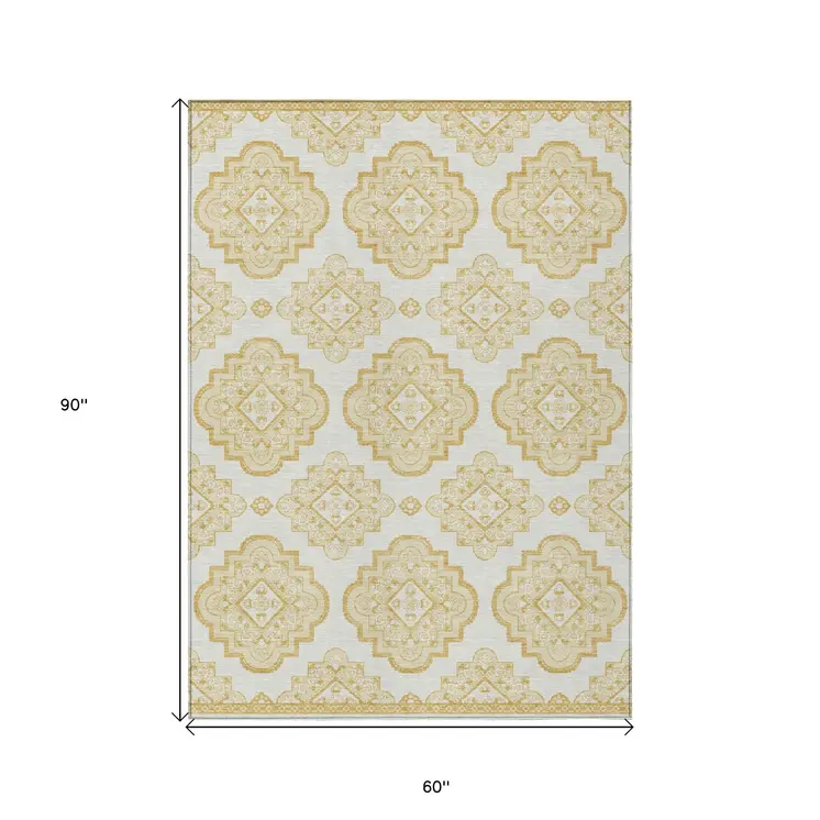 5' X 8' Gold And Ivory Medallion Washable Indoor Outdoor Area Rug