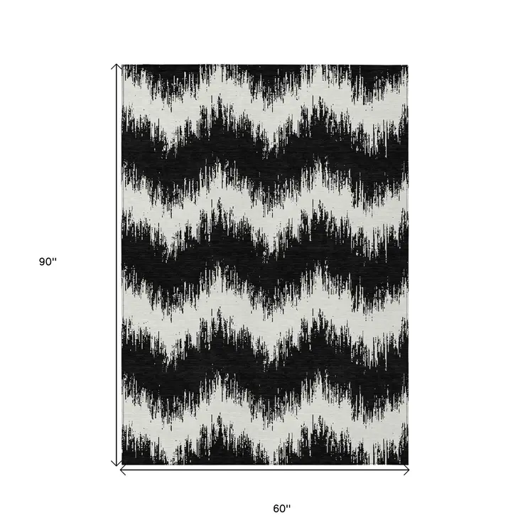 5' X 8' Black And Ivory Chevron Washable Indoor Outdoor Area Rug