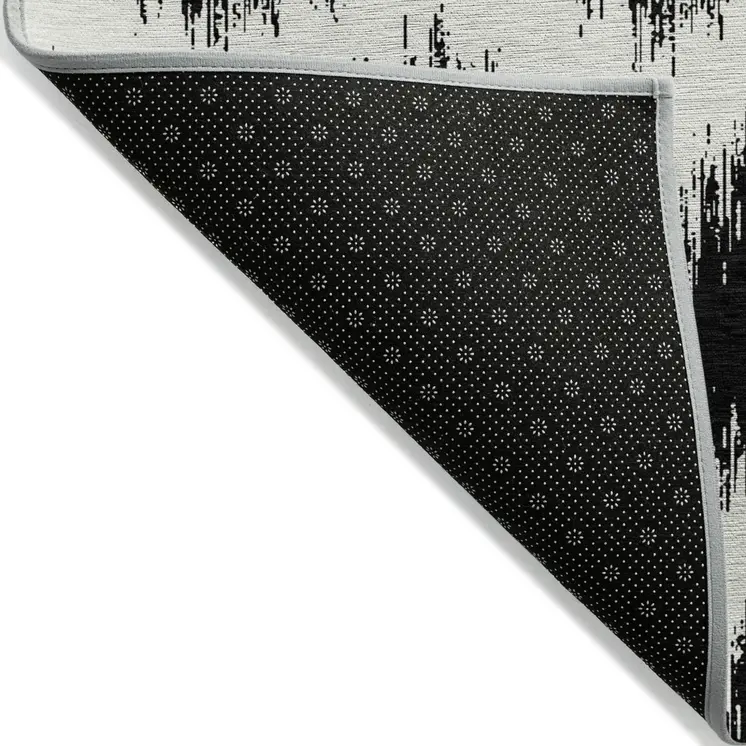 5' X 8' Black And Ivory Chevron Washable Indoor Outdoor Area Rug