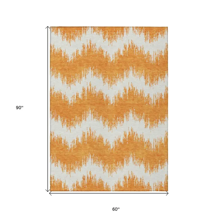 5' X 8' Orange And Ivory Chevron Washable Indoor Outdoor Area Rug