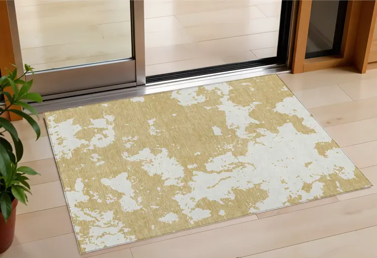 3' X 5' Gold And Ivory Abstract Washable Indoor Outdoor Area Rug