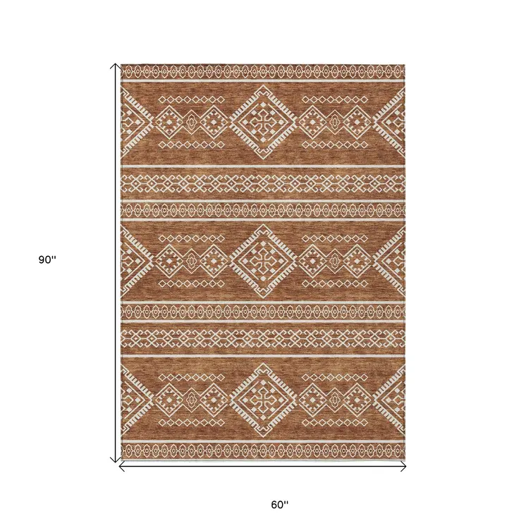 5' X 8' Orange And Ivory Southwestern Washable Indoor Outdoor Area Rug