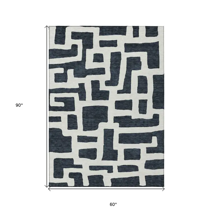 5' X 8' Black And Ivory Abstract Washable Indoor Outdoor Area Rug