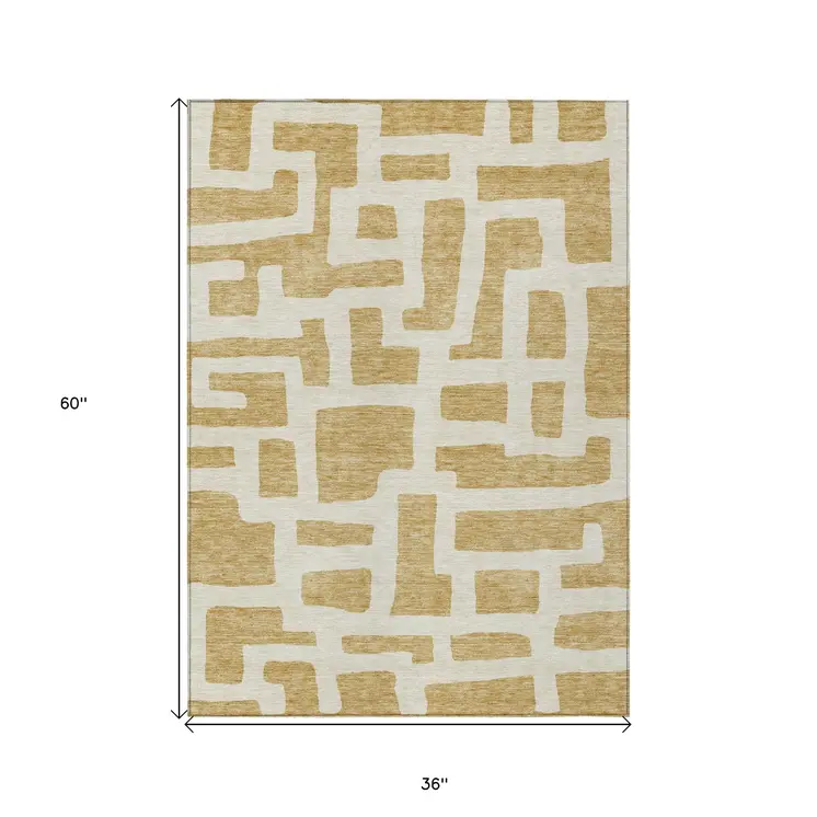 3' X 5' Gold And Ivory Abstract Washable Indoor Outdoor Area Rug