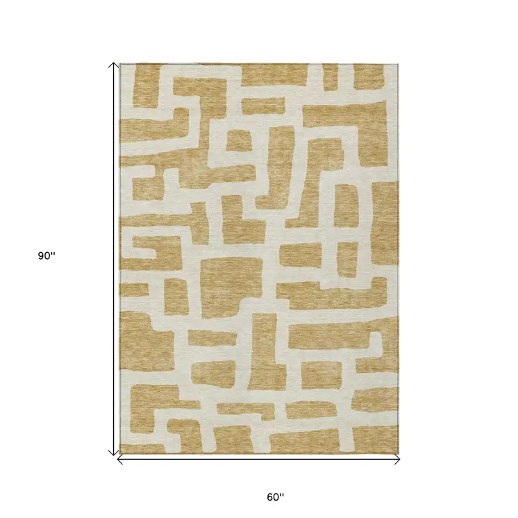 5' X 8' Gold And Ivory Abstract Washable Indoor Outdoor Area Rug