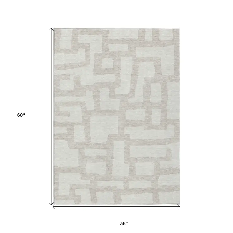3' X 5' Ivory And Beige Abstract Washable Indoor Outdoor Area Rug