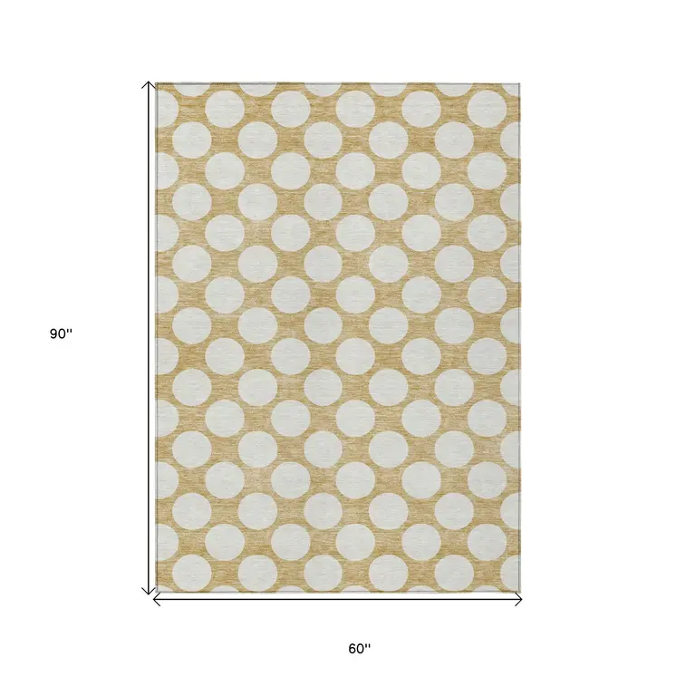 5' X 8' Gold And Beige Polka Dot Washable Indoor Outdoor Area Rug
