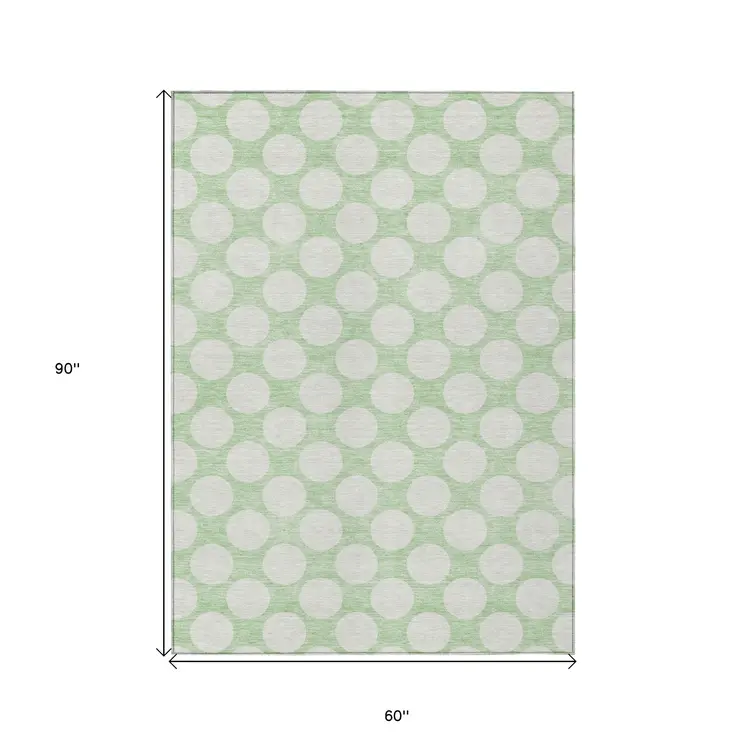 5' X 8' Mint Green And Ivory Polka Dot Washable Indoor Outdoor Area Rug