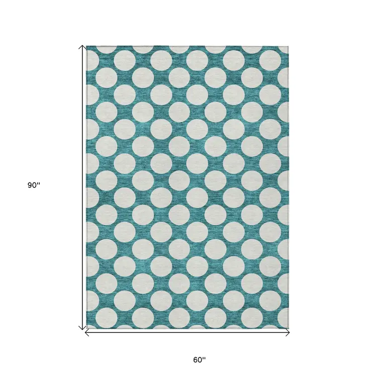 5' X 8' Teal Blue And Ivory Polka Dot Washable Indoor Outdoor Area Rug