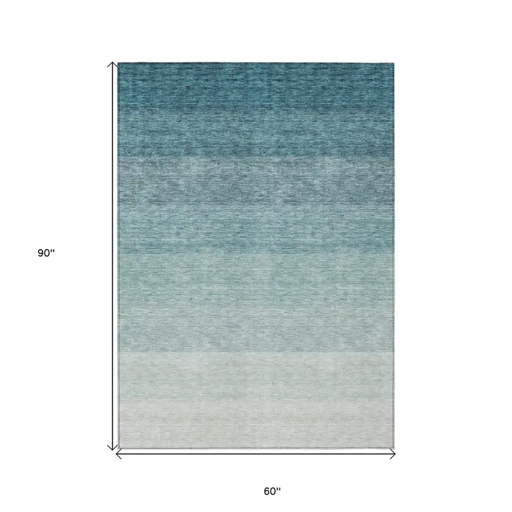 5' X 8' Teal Blue And Ivory Ombre Washable Indoor Outdoor Area Rug