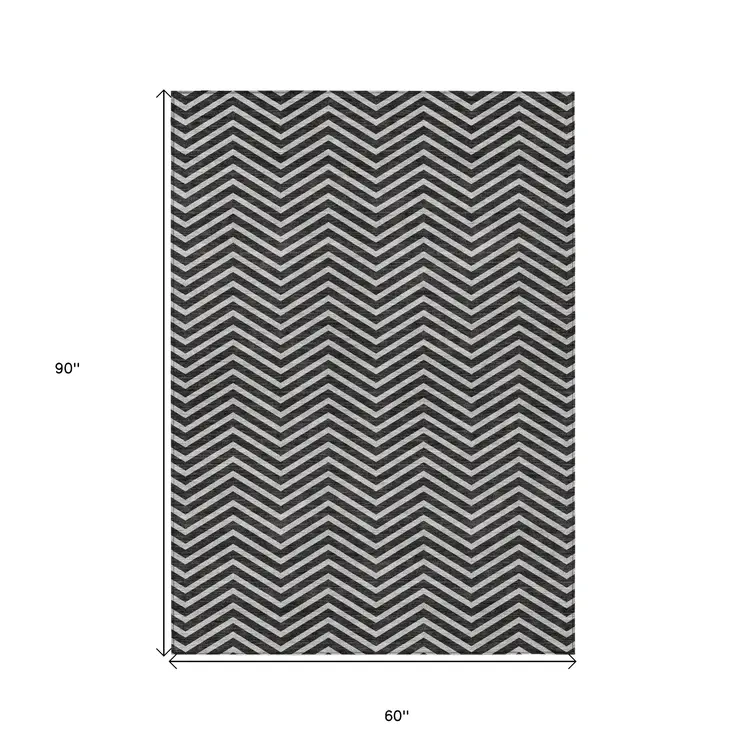 5' X 8' Black And Ivory Chevron Washable Indoor Outdoor Area Rug