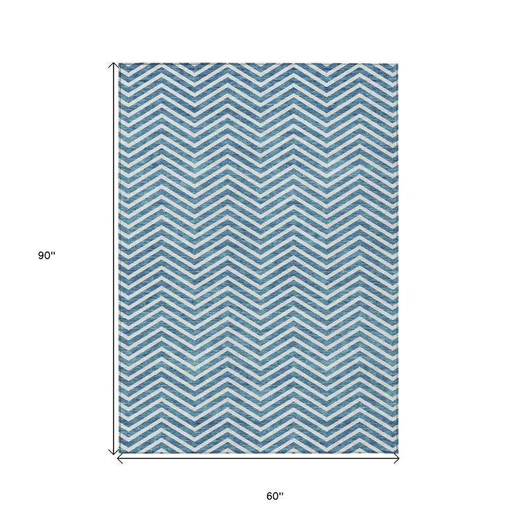 5' X 8' Teal Blue And Ivory Chevron Washable Indoor Outdoor Area Rug