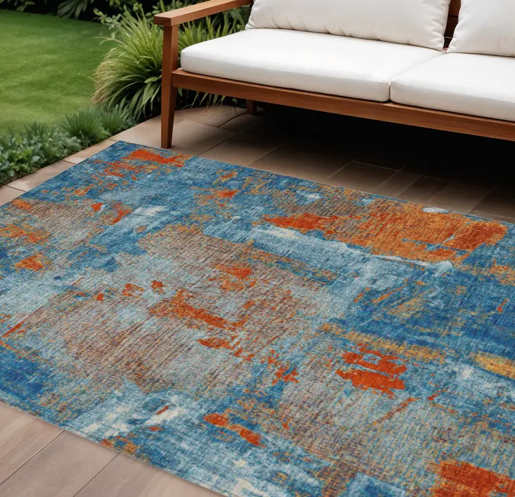 9' X 12' Navy Blue Orange And Ivory Abstract Washable Indoor Outdoor Area Rug