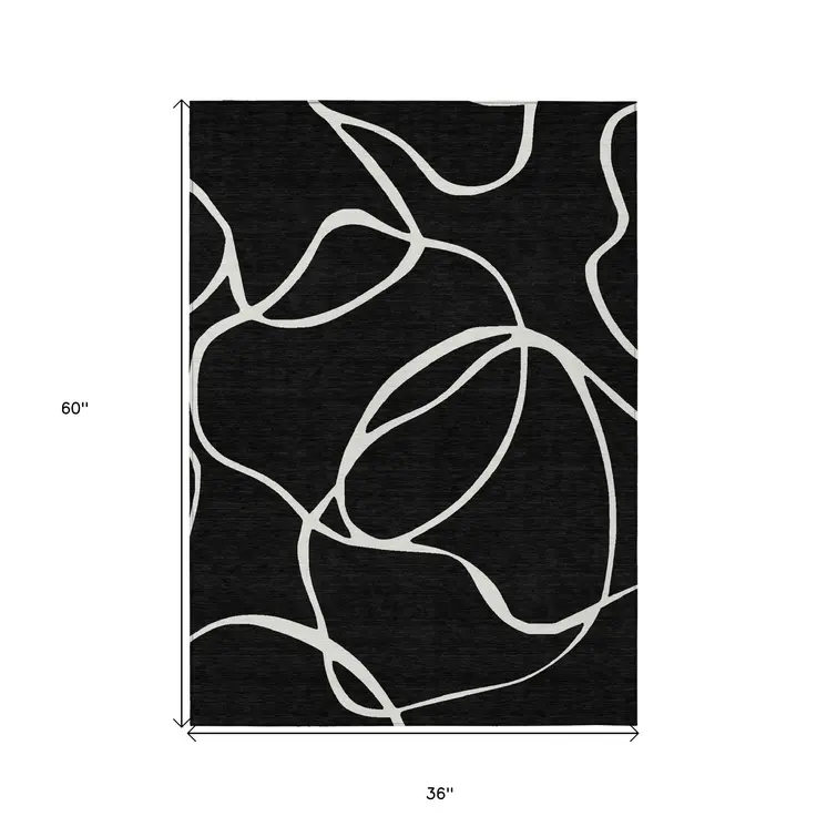 3' X 5' Black And Ivory Abstract Washable Indoor Outdoor Area Rug