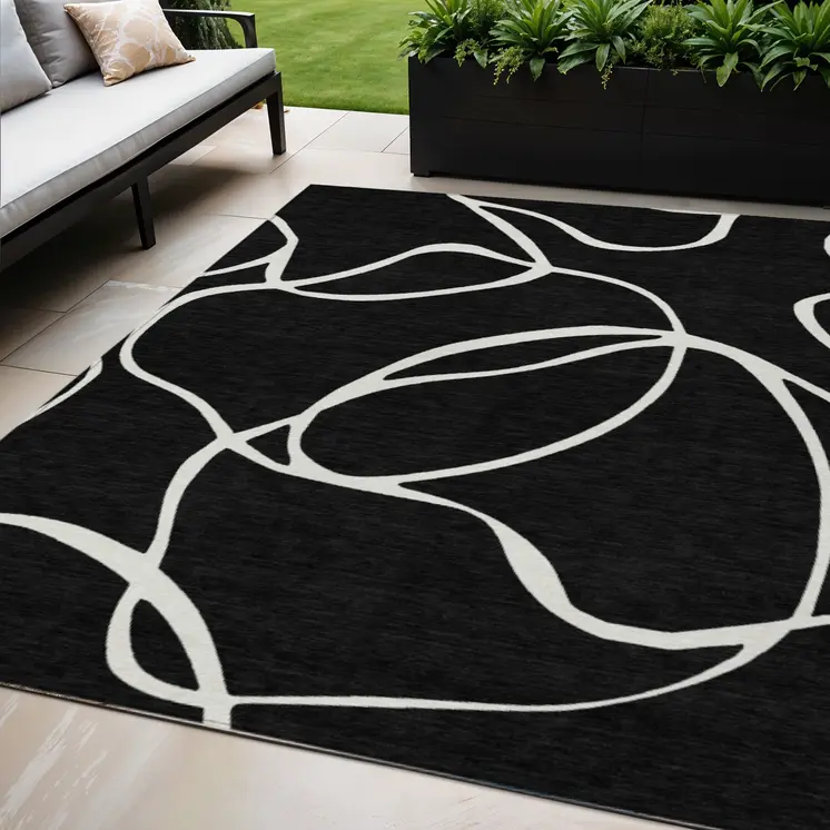 5' X 8' Black And Ivory Abstract Washable Indoor Outdoor Area Rug