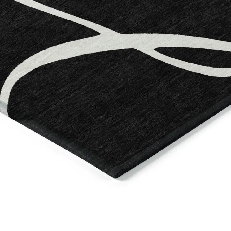5' X 8' Black And Ivory Abstract Washable Indoor Outdoor Area Rug