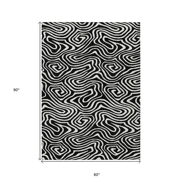 5' X 8' Black And Ivory Abstract Washable Indoor Outdoor Area Rug