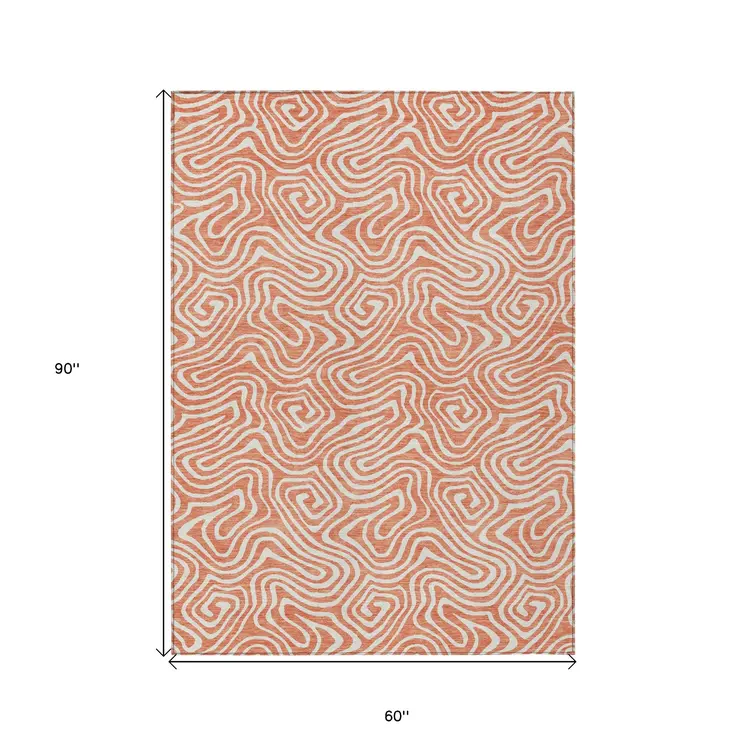 5' X 8' Salmon And Ivory Abstract Washable Indoor Outdoor Area Rug