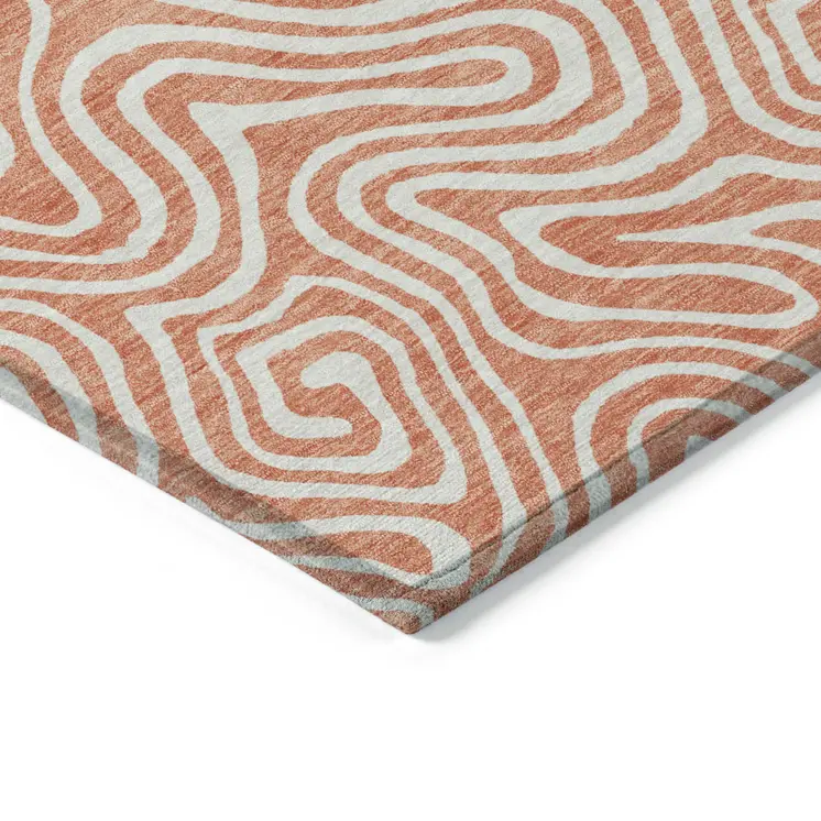 5' X 8' Salmon And Ivory Abstract Washable Indoor Outdoor Area Rug
