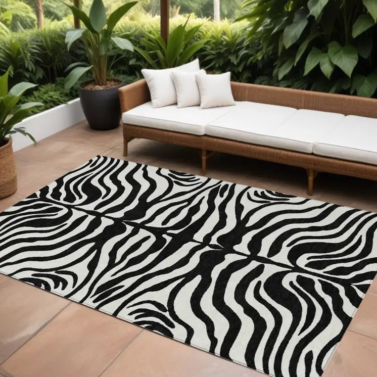 9' X 12' Black And Ivory Animal Print Washable Indoor Outdoor Area Rug