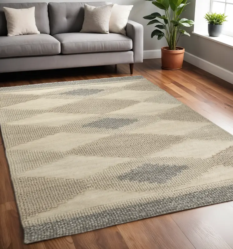 5' X 8' Beige Brown Gray And Ivory Wool Geometric Hand Woven Area Rug