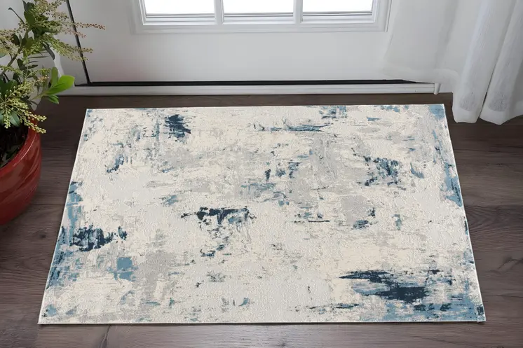 2' X 3' Blue Cream And Gray Abstract Area Rug