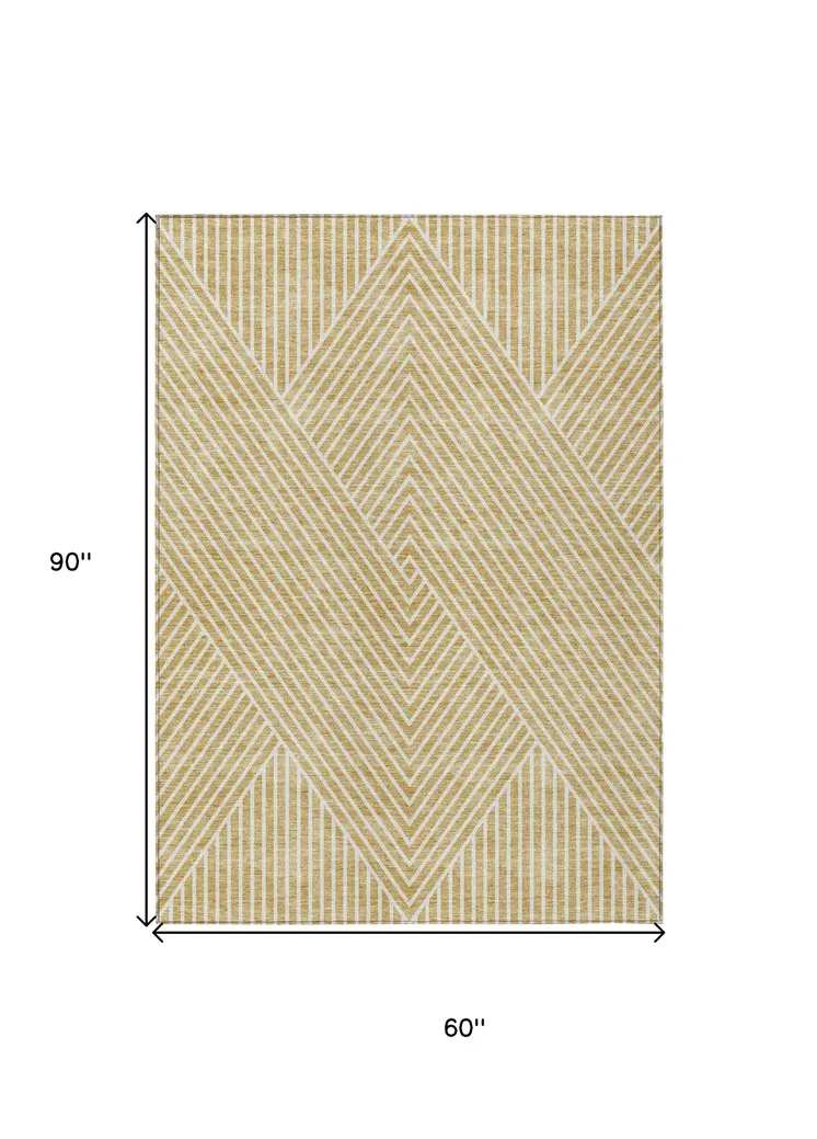 5' X 8' Gold And Ivory Geometric Washable Indoor Outdoor Area Rug