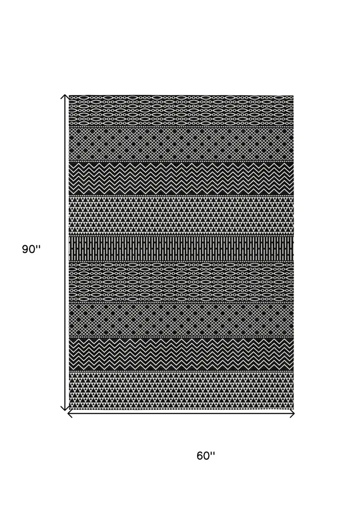 5' X 8' Black And Ivory Chevron Washable Indoor Outdoor Area Rug