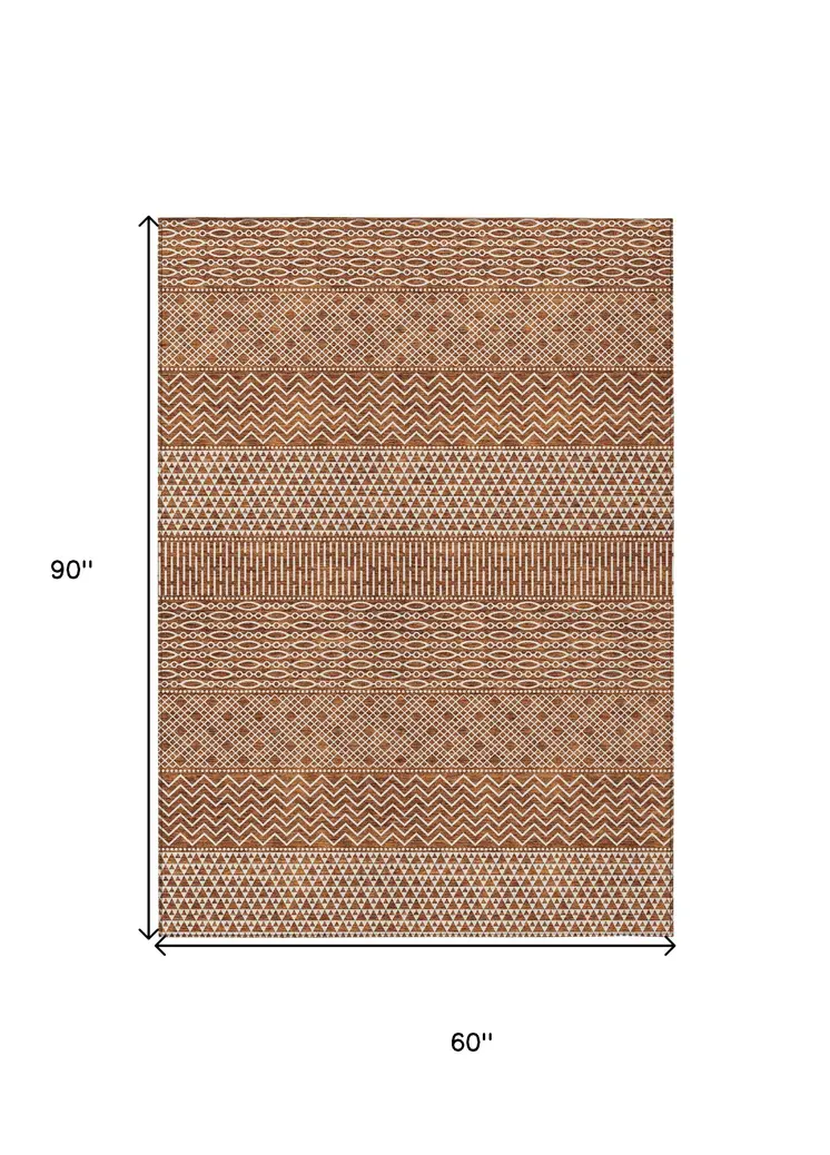 5' X 8' Orange And Ivory Chevron Washable Indoor Outdoor Area Rug