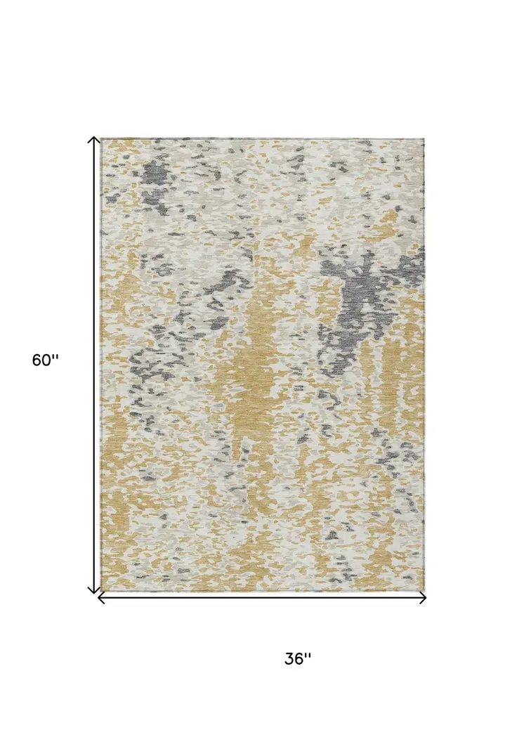3' X 5' Gold And Ivory Abstract Washable Indoor Outdoor Area Rug