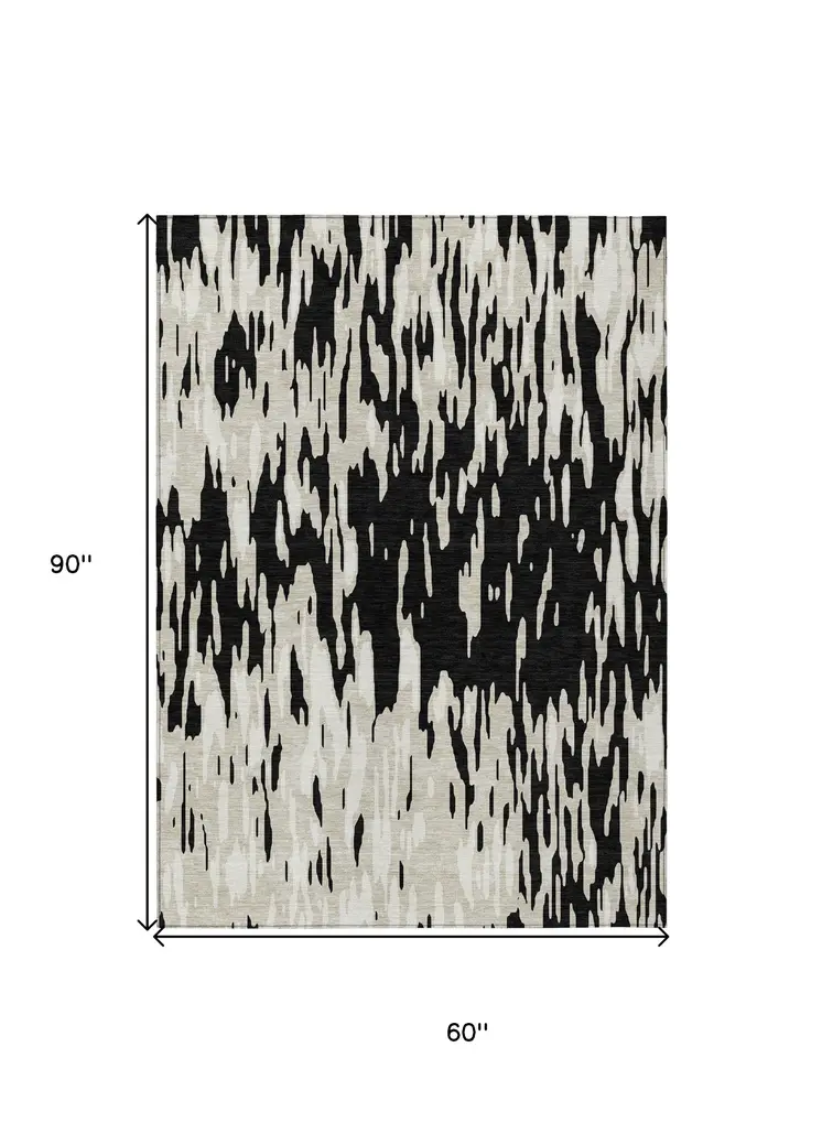 5' X 8' Black And Ivory Abstract Washable Indoor Outdoor Area Rug