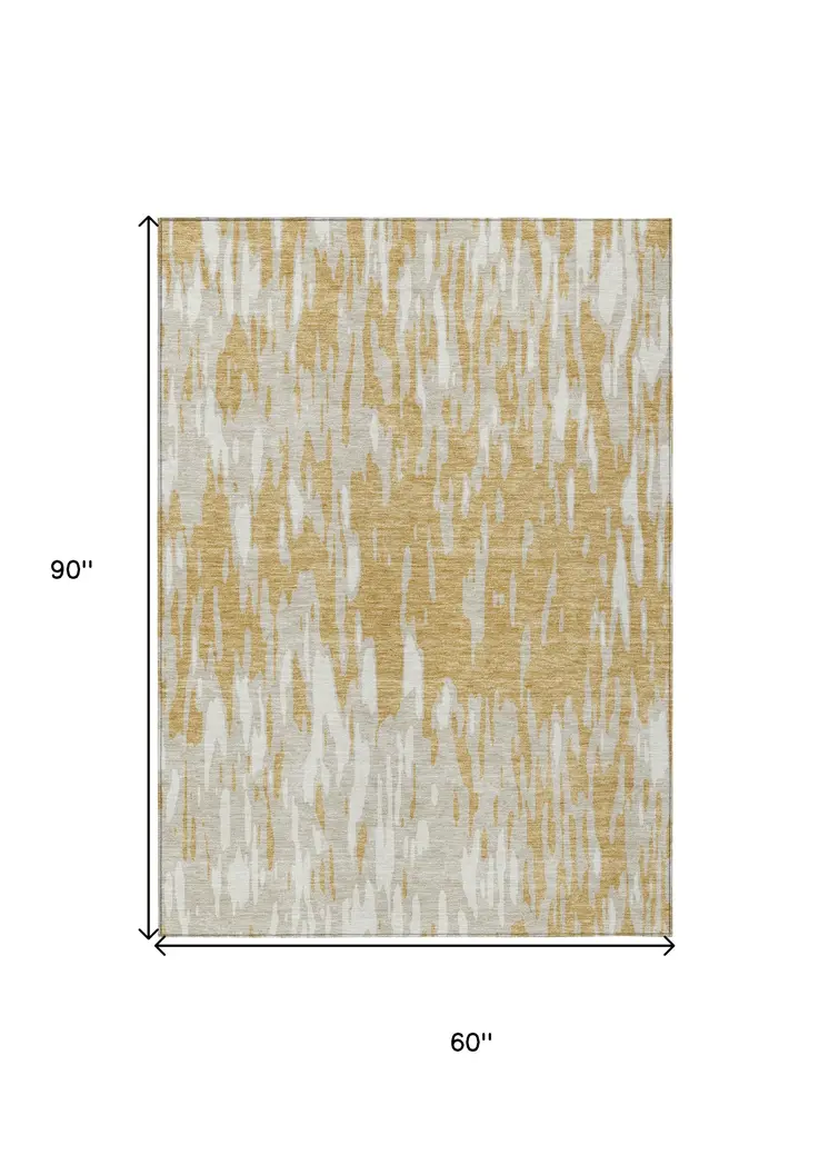 5' X 8' Gold And Ivory Abstract Washable Indoor Outdoor Area Rug