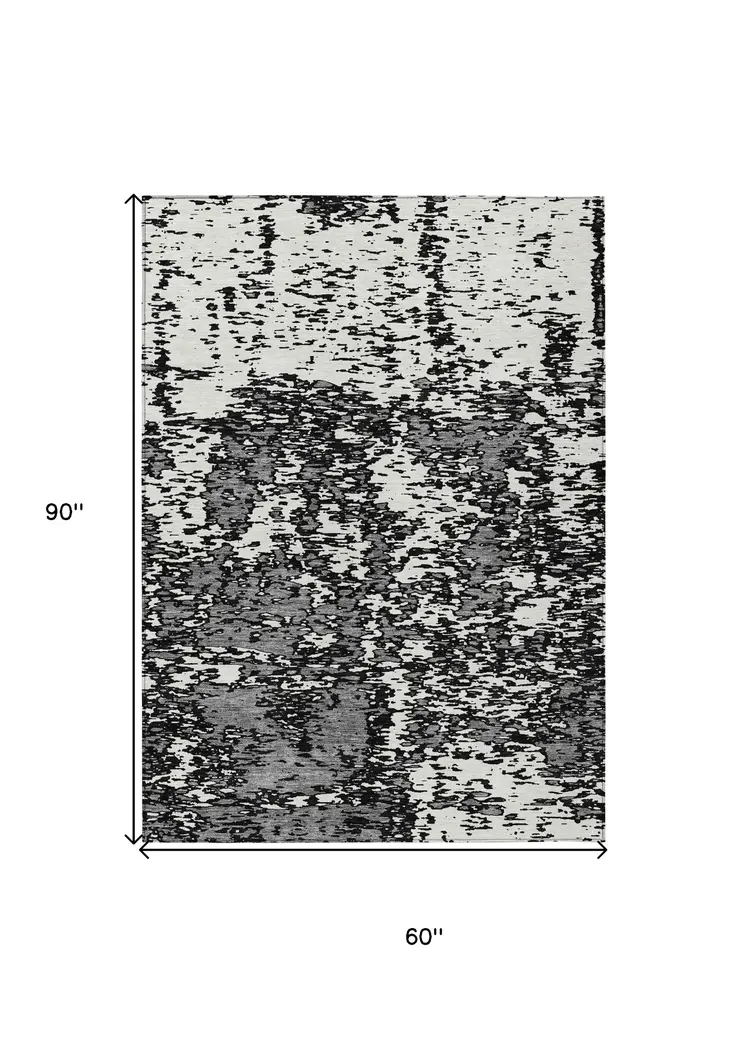 5' X 8' Black And Ivory Abstract Washable Indoor Outdoor Area Rug