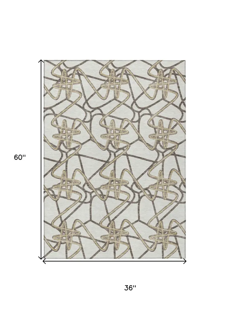 3' X 5' Ivory Charcoal And Gold Geometric Washable Indoor Outdoor Area Rug