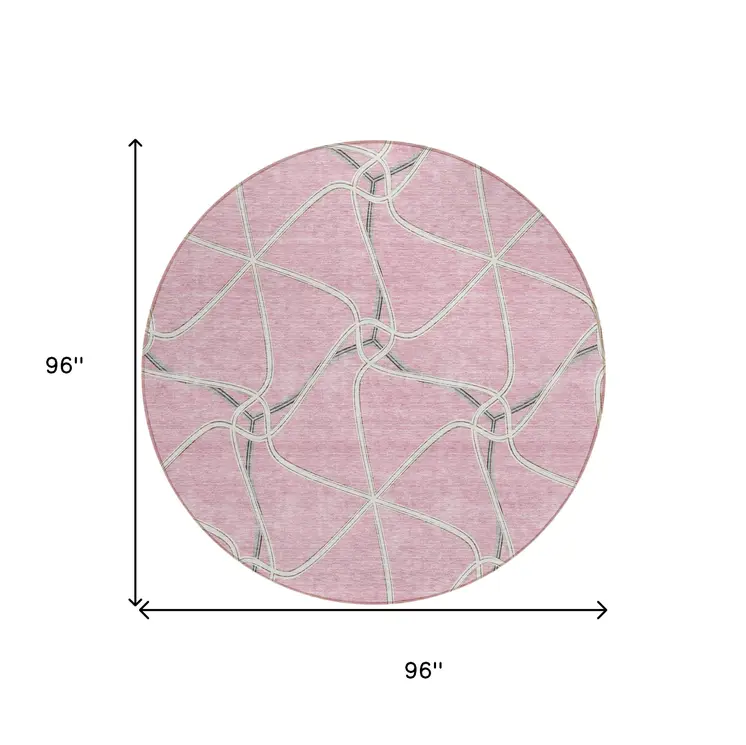 8' Pink And Ivory Round Geometric Washable Indoor Outdoor Area Rug