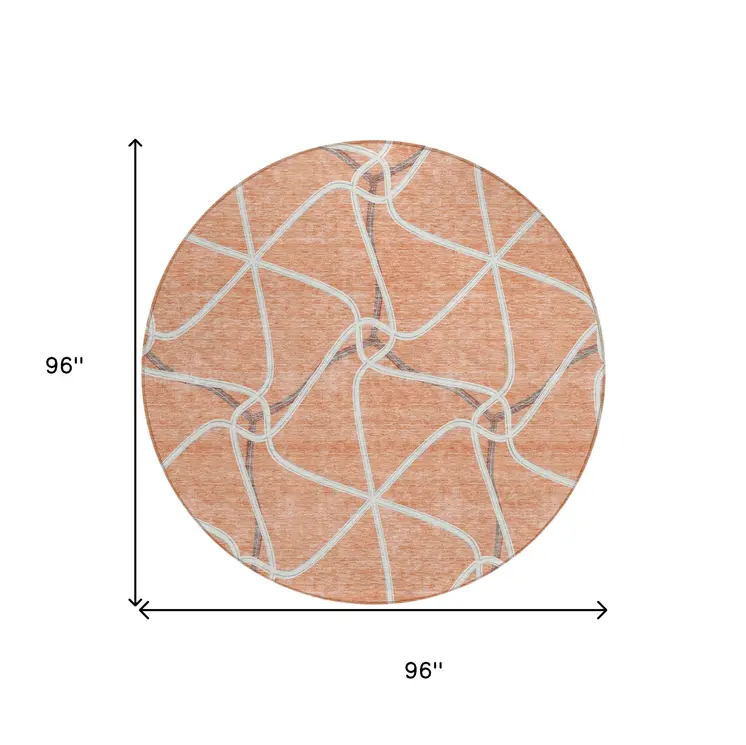 8' Salmon And Ivory Round Geometric Washable Indoor Outdoor Area Rug