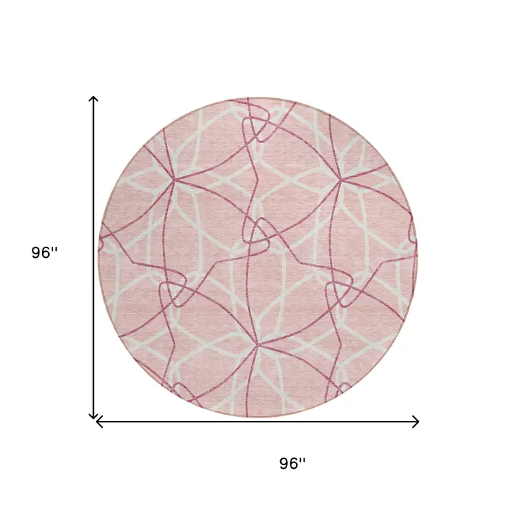 8' Pink And Ivory Round Geometric Washable Indoor Outdoor Area Rug
