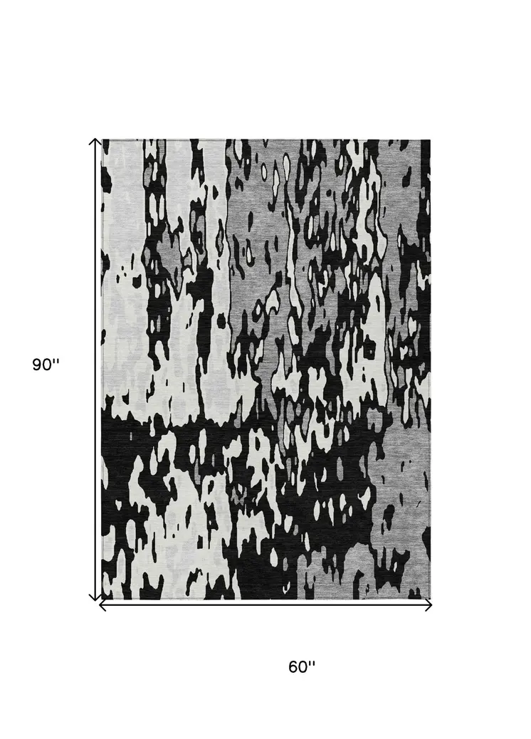 5' X 8' Black And Ivory Abstract Washable Indoor Outdoor Area Rug