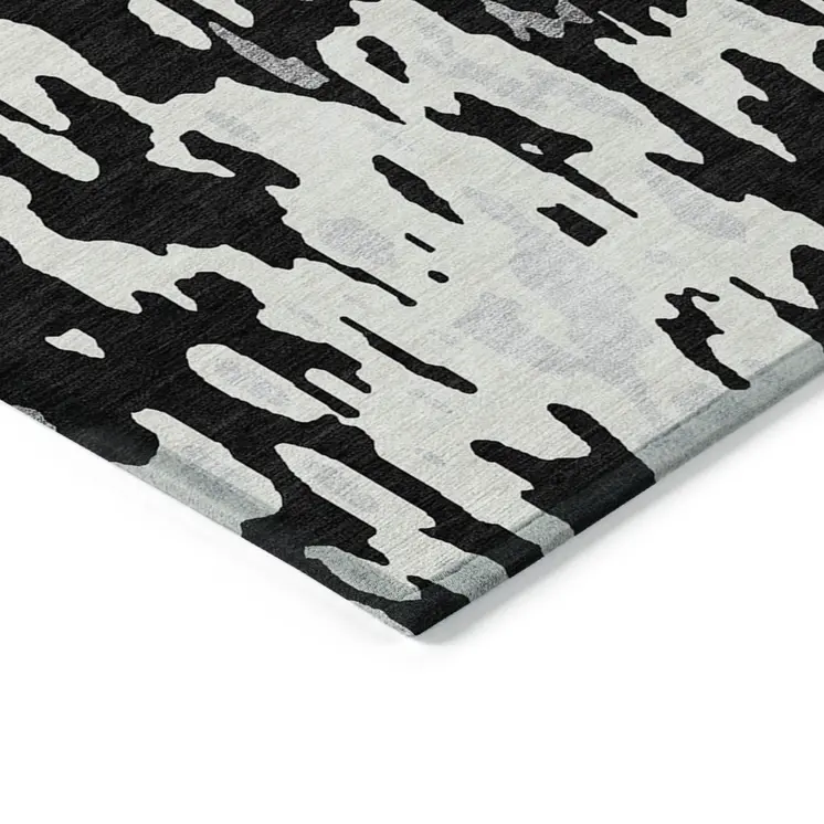 5' X 8' Black And Ivory Abstract Washable Indoor Outdoor Area Rug