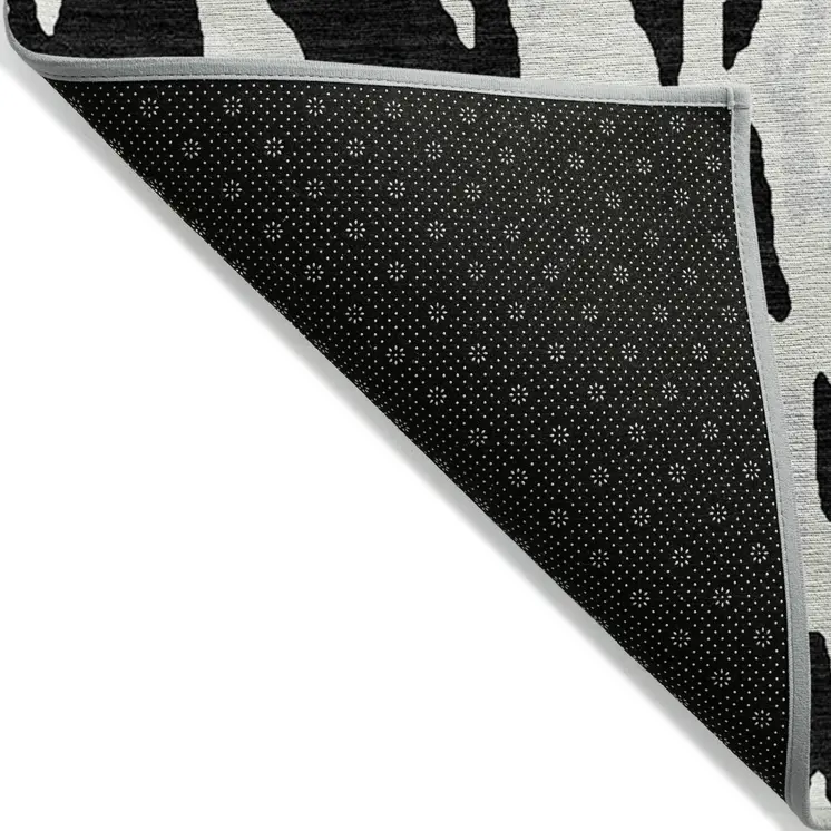 9' X 12' Black And Ivory Abstract Washable Indoor Outdoor Area Rug